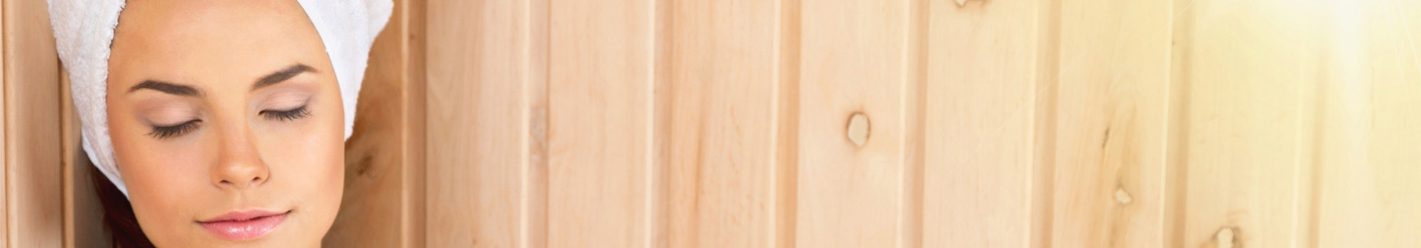 Woman relaxing in sauna